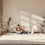 Parent and child relax on clean carpet in bright Montreal living room